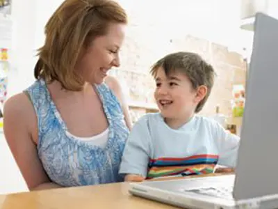 Mother and son working at computer