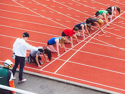 runners lined up on a track