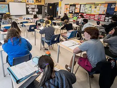 Secondary students sitting in class 