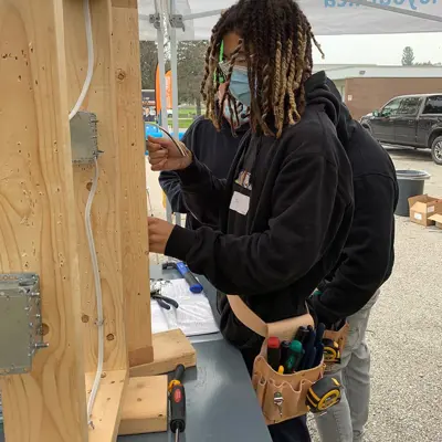 Student working with electrical wires 