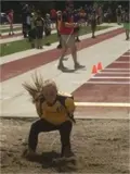 Student landing the long jump