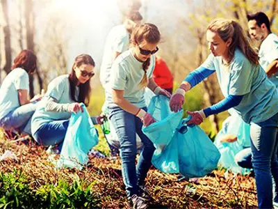 Students cleaning up a park