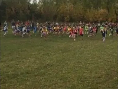 Students running across a field