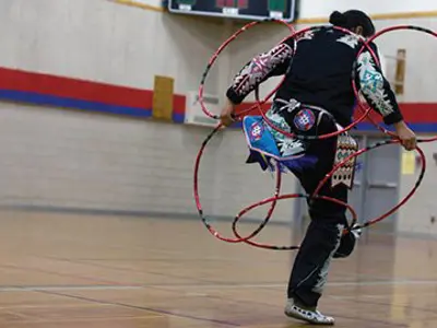 A student doing a hoop dance