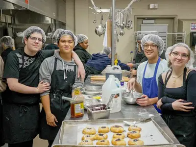 Students learning in the school kitchen