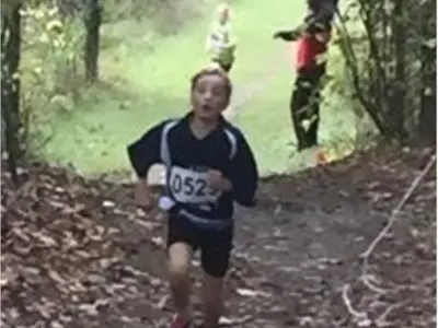 Students running on a trail