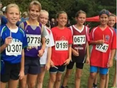 Cross country student participants standing in a line