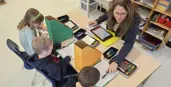 Teacher working with 3 students