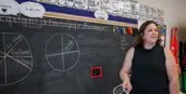 Teacher at chalkboard